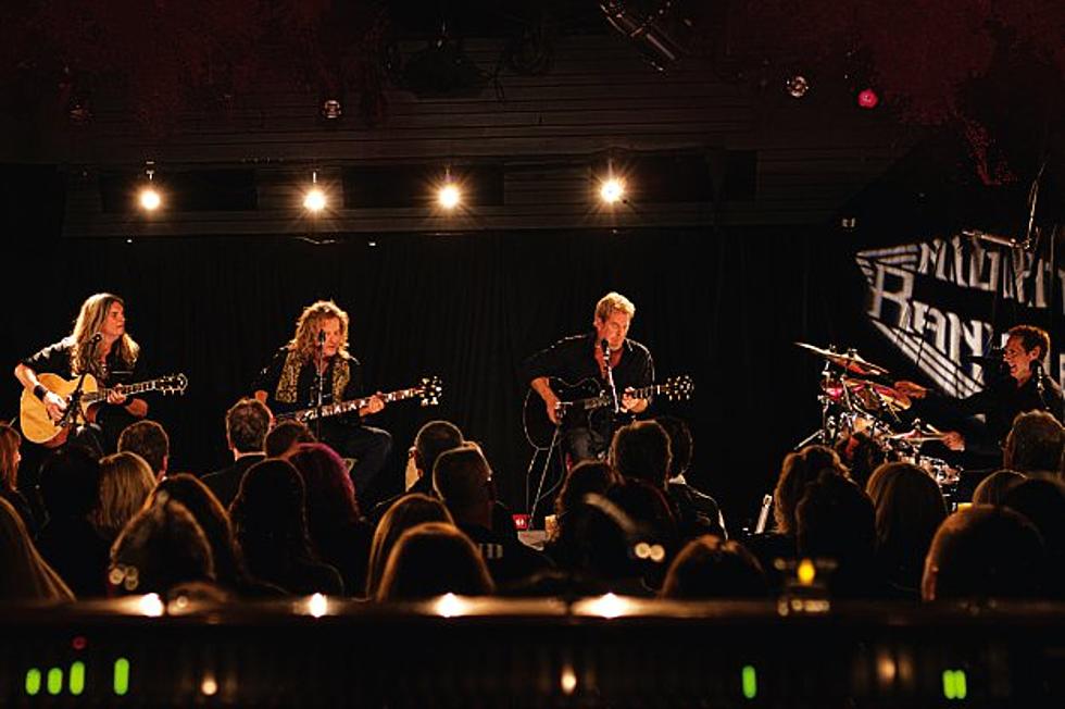 Night Ranger on stage sitting playing acoustic istruments